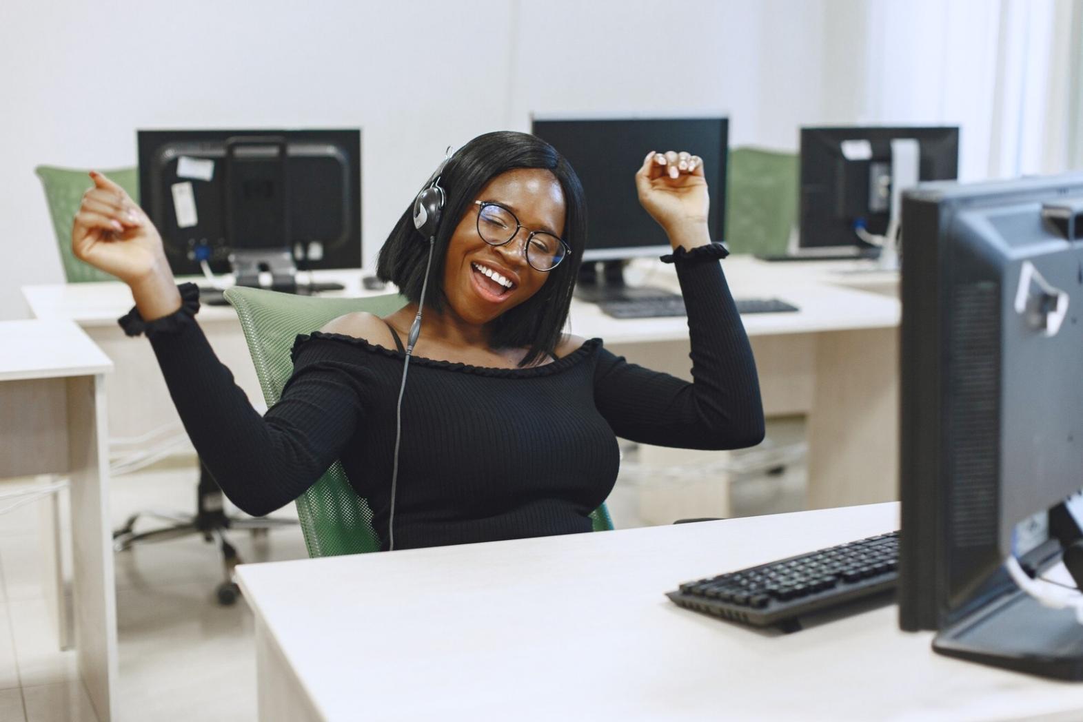 Team collaborating on AI development project with code on screens
